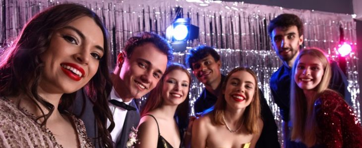 Students smile for the camera at a school dance