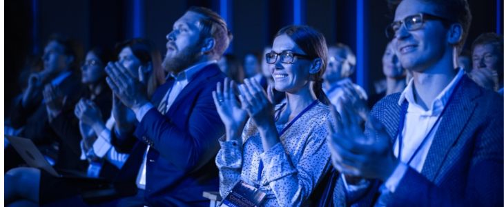 the audience at a corporate convention lecture