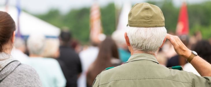 A Veteran saluting at a military event